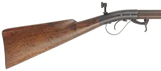 Underhammer Rifle,
.50 caliber, 41-3/4" barrel,
percussion, figured walnut, iron trim, 
glove and peep sight, used